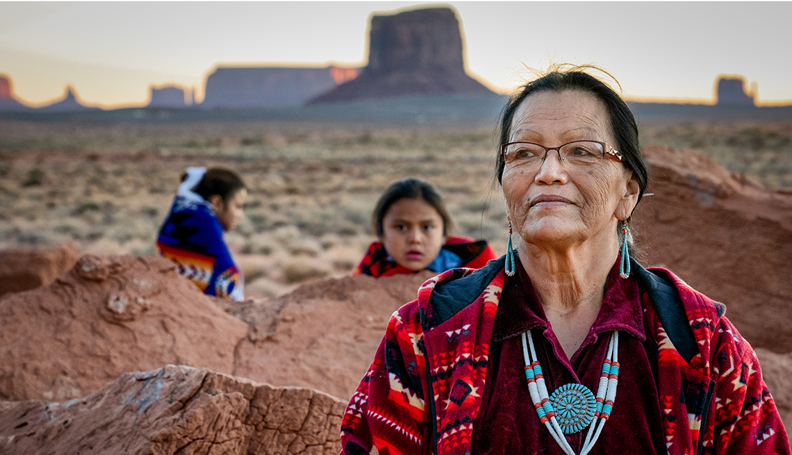 a Navajo woman standing outdoors at the Monument Valley Tribal Park in Northern Arizona