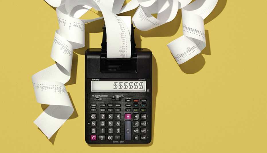 a black adding machine on a gold field with tape coming out of it and dollar signs on display