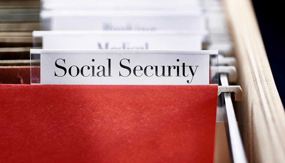 hanging file folders with a label that says social security in front