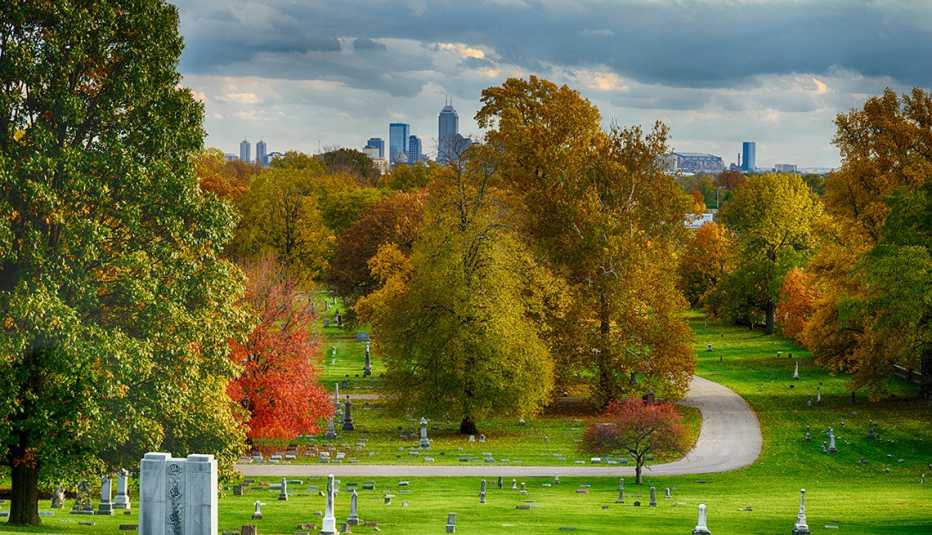crown hill cemetery in indianpolis in the fall with city buildings in the background