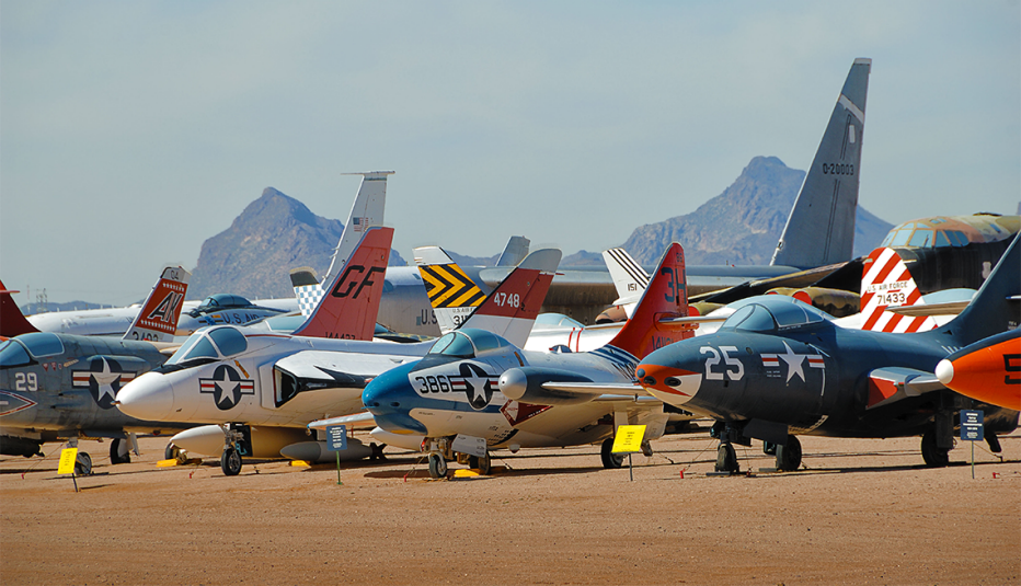 a row of historic aircraft at the pima air and space museum