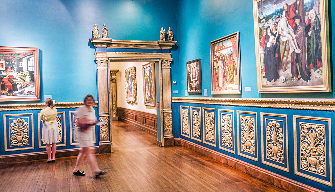 two women look at artwork inside the john and mable ringling museum of art in sarasota, florida