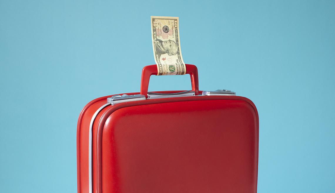 Red Suitcase With Money Tied To Handle, How To Save On Airfare
