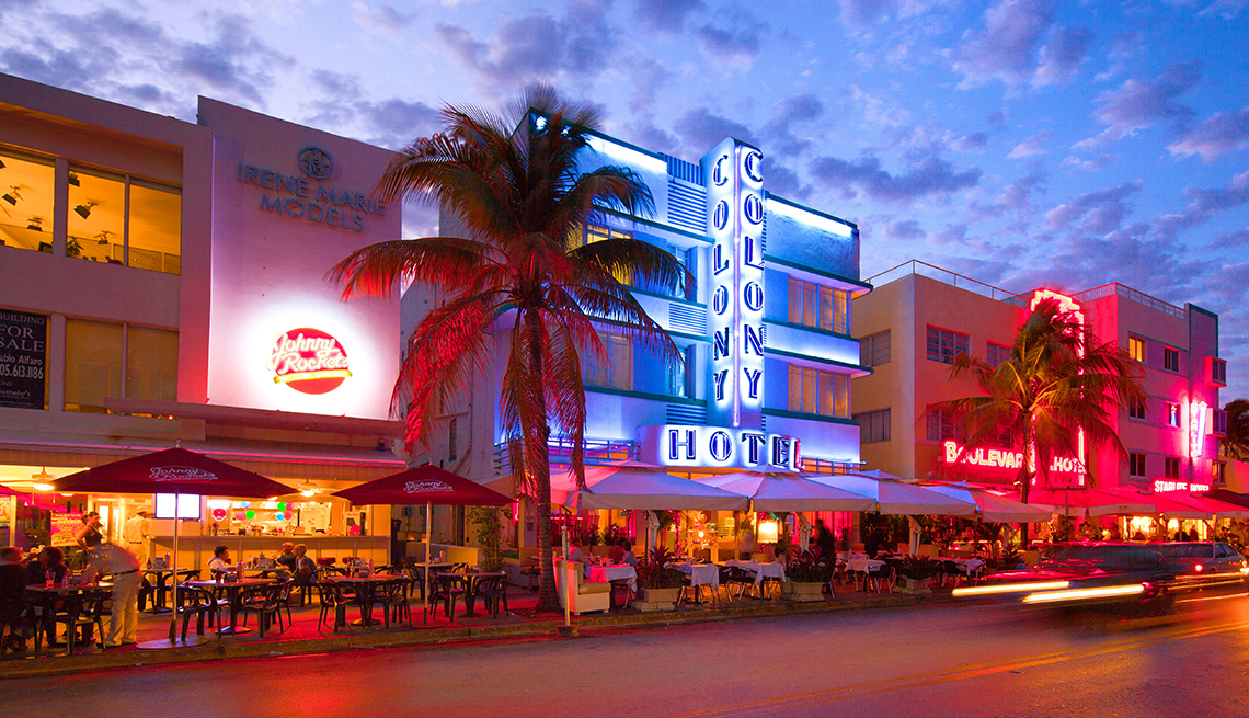 Art Deco historic buildings in Miami Florida are lit in various colors