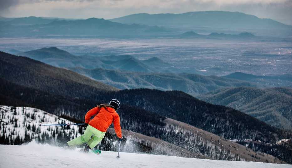 a person skiis down a mountain in santa fe new mexico