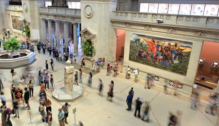 People roam around the entrance on reopening day at The Metropolitan Museum of Art