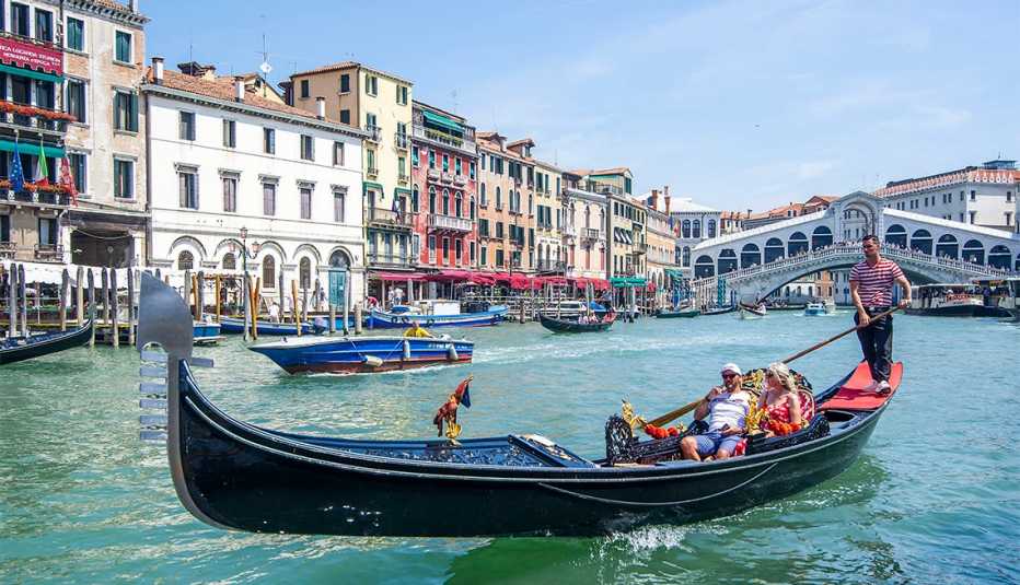 Tourists enjoy a gondola ride on June 12, 2021 in Venice, Italy