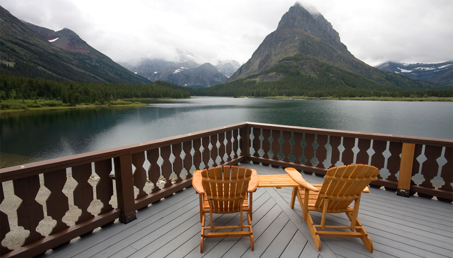 adirondack chairs on the deck of many glacier lodge in glacier national park montana