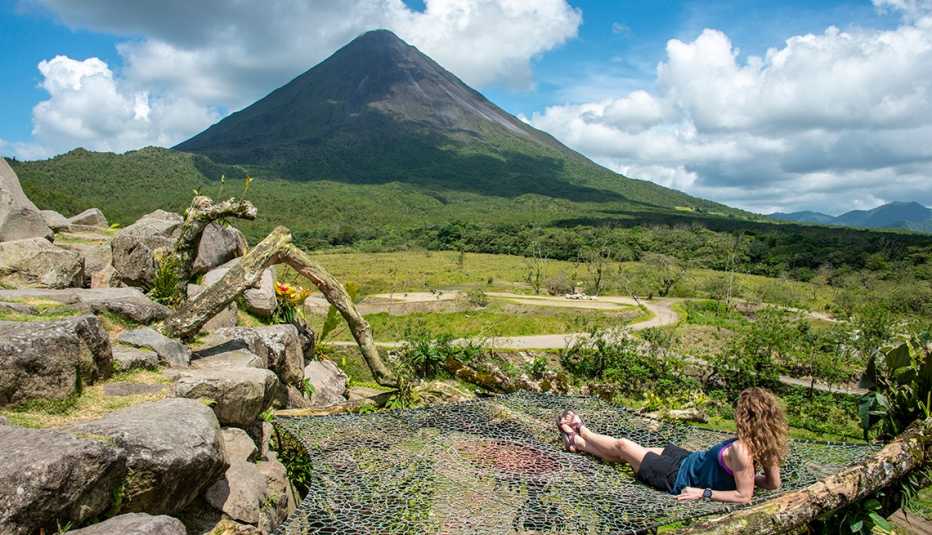 woman resting near Costa Rica's Arenal volcano