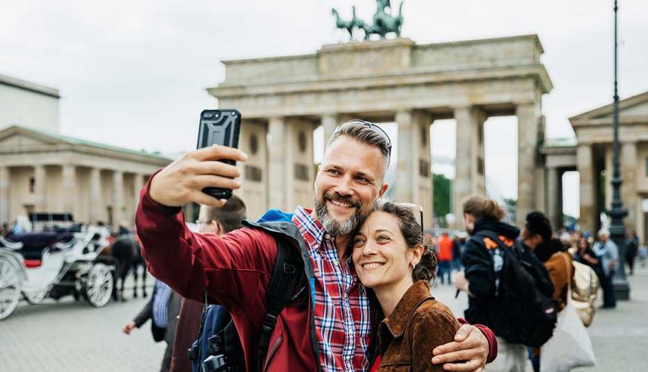 A smiling couple takes a selfie while in Berlin