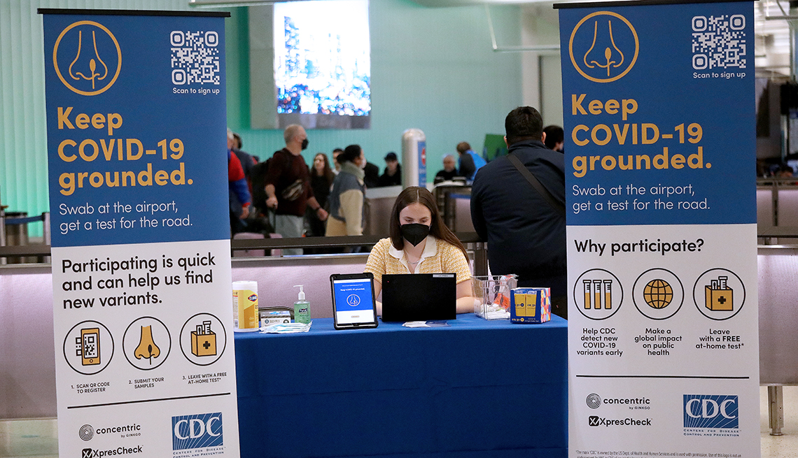A worker at a voluntary CDC testing location at LAX airport