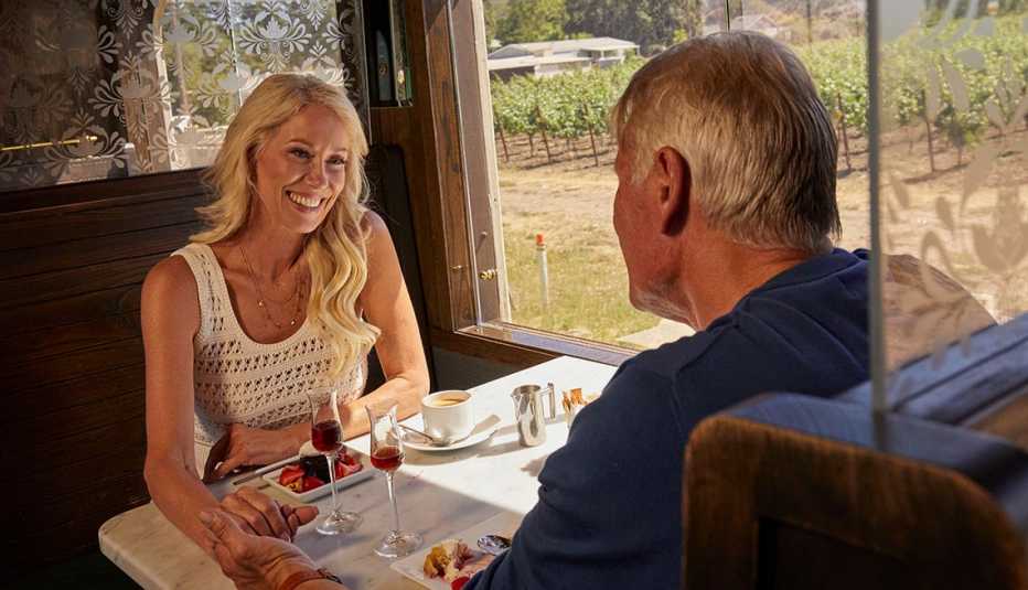a couple sharing food and wine on the napa valley wine train