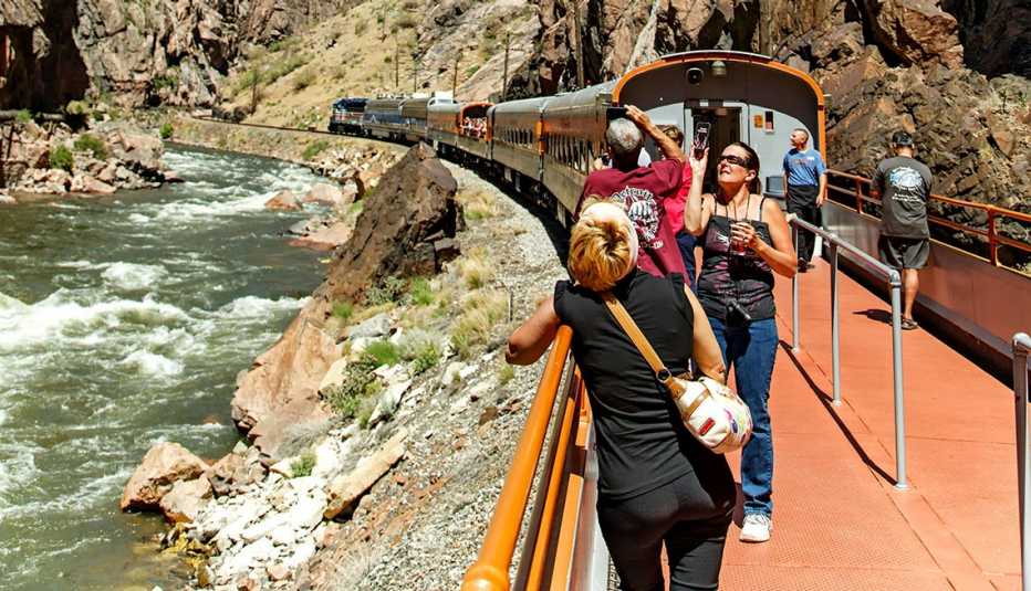 passengers on an outdoor terrace car on the royal gorge route railroad in colorado