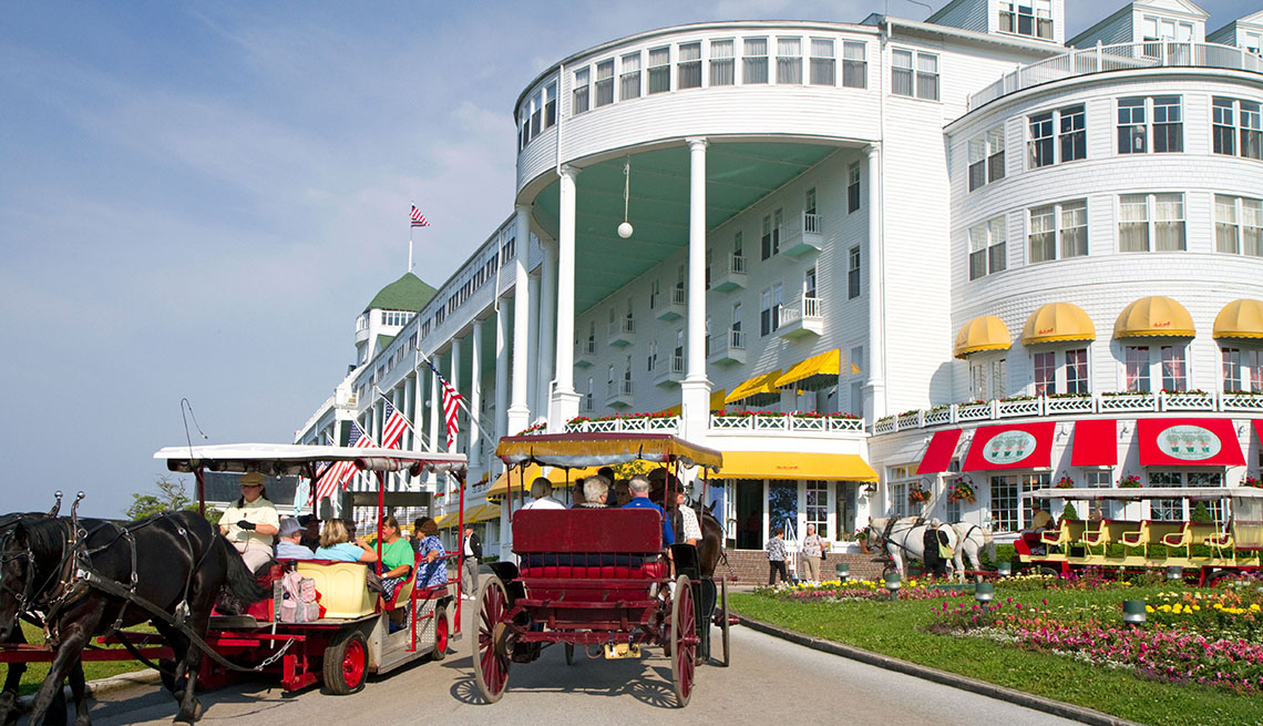 Guests Ride In Horse And Buggy And Roll Up To The Grand Hotel In Mackinac Islsand Off Lake Huron In Michigan, Great Lake Vacation Ideas