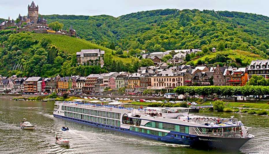 Cruise Ship Travels Through Canal With Houses On The Banks, Find The Cruise Ship For You