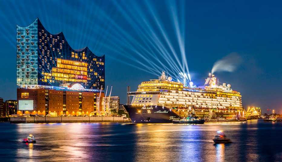 Cruise ship with bright lights in port at night