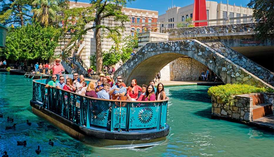 people on a boat tour along San Antonio Riverwalk