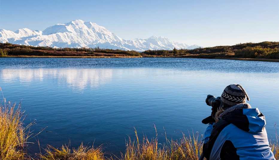 Photographer takes photos from the Mount McKinley, Reflection Pond