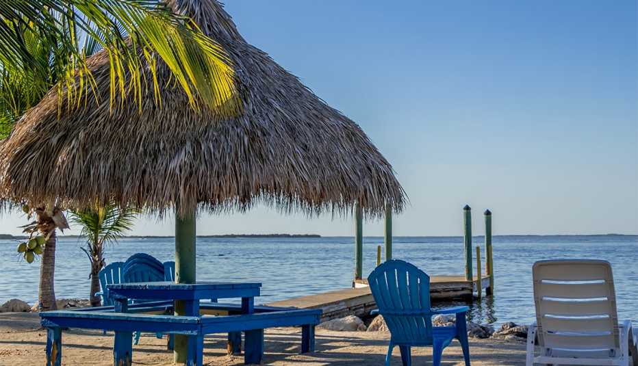beach chairs and a dock at the ocean in Key Largo, Florida