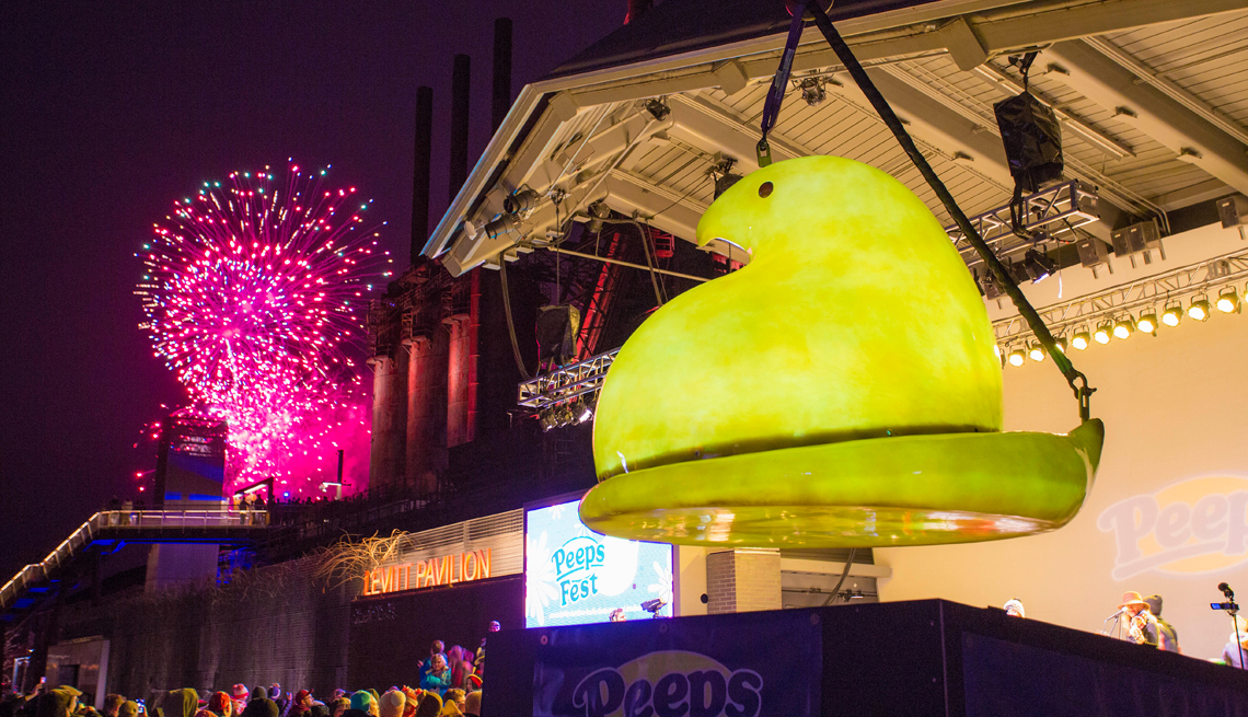 fireworks burst in the background as bethlehem pennsylvania drops a giant glowing peep for new years