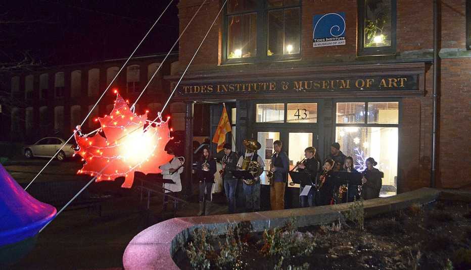people assemble in Eastport, Maine to watch the maple leaf drop