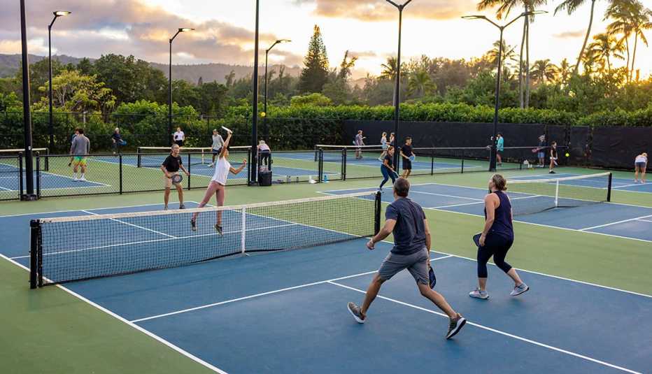 guests playing pickleball at turtle bay resort in oahu hawaii
