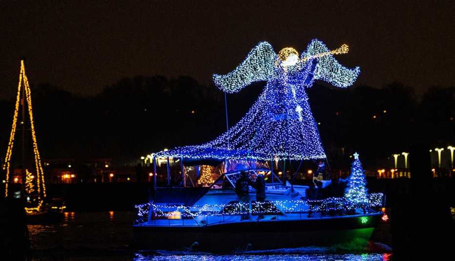 an angel in lights on a boat for the Alexandria Boat Parade