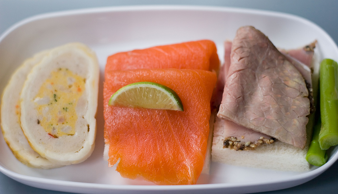 Close Up Of A In Flight Meal Consisting Of Salmon And Roast Beef