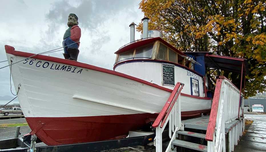 a fishing boat outside of The Bowpicker Fish & Chips Restaurant