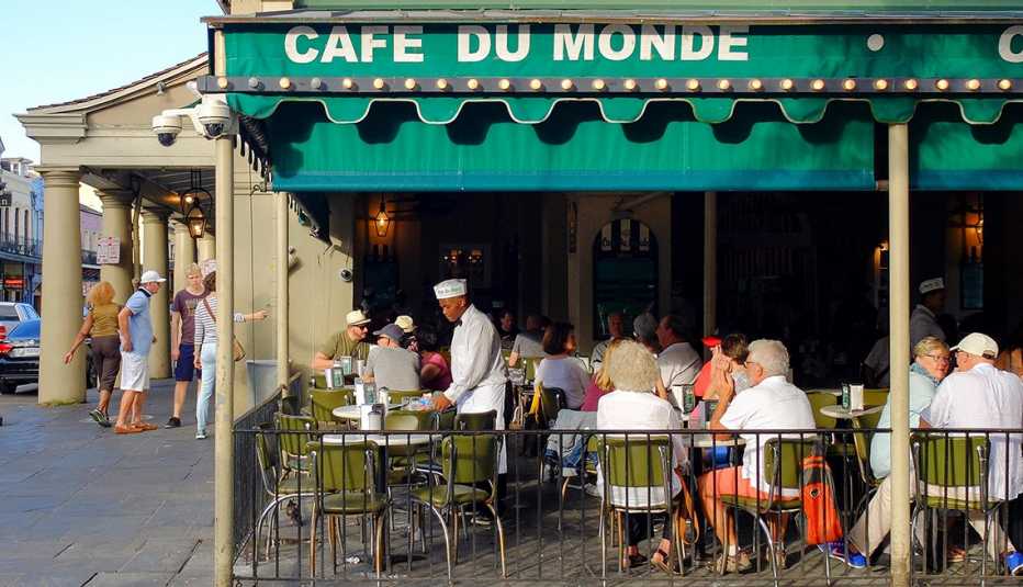 Customers in Outdoor Seating at Cafe du Monde, New Orleans, Great U.S. Getaways for Food Lovers