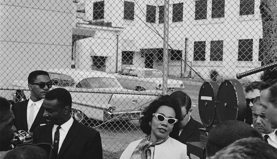 Coretta Scott King the wife of civil rights activist Martin Luther King Jr., with fellow activist Fred Shuttlesworth outside Birmingham City Jail, following her husband's arrest for his part in the Birmingham campaign, Alabama, April 1963