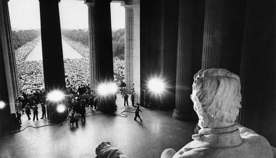 "March on Washington participants, marching from the Washington Monument, gather in front of the Lincoln Memorial to protest race discrimination."