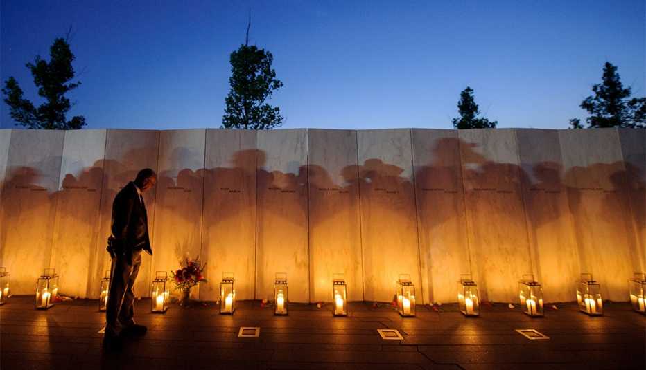 A man pauses before a name on the wall during the Flight 93 National Memorial's annual Luminaria 