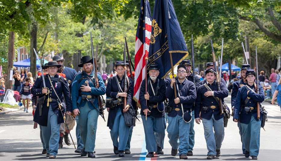july 4 festival goers dress in union uniforms during a parade in bristol, rhode island