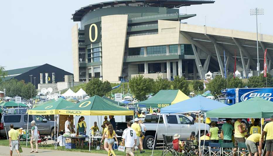 Exterior view of Autzen Stadium with tailgating fans in parking lot before Oregon vs Michigan State game