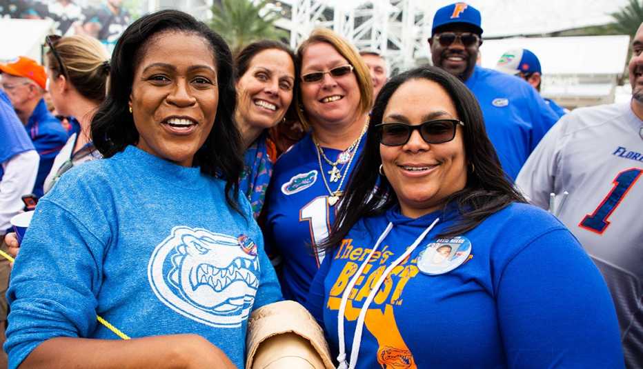 a group of University of Florida alumni smiling before a football game