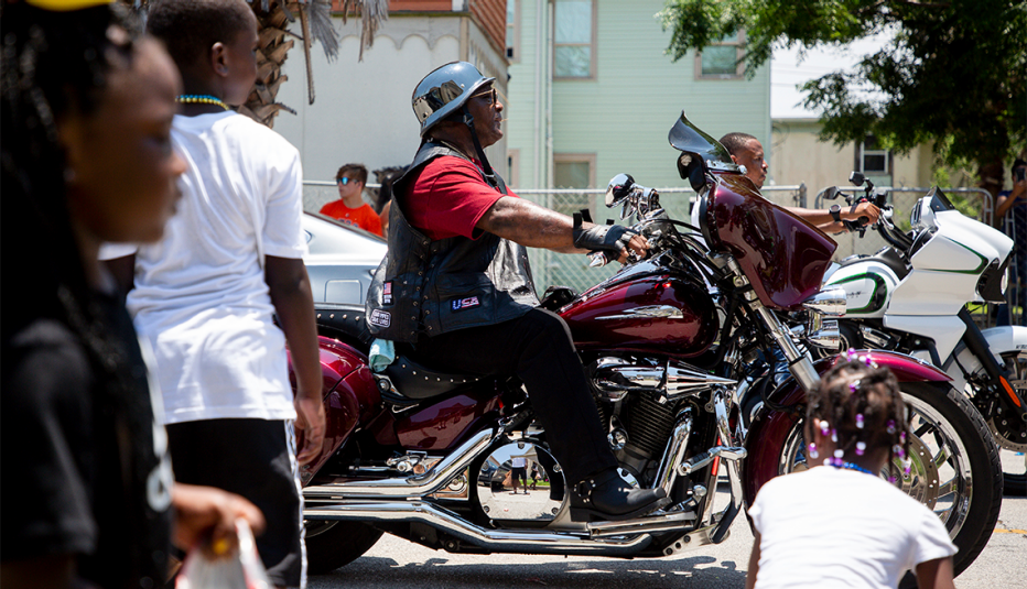 children watching motorcyclists ride by during the juneteenth parade in galveston texas