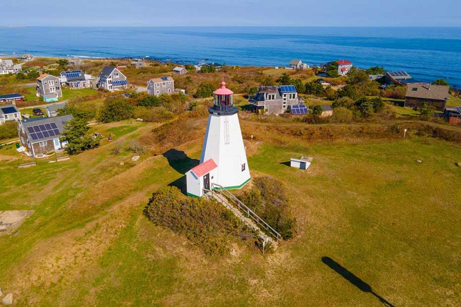 an aerial view of the gurnet lighthouse and the village of gurnet point