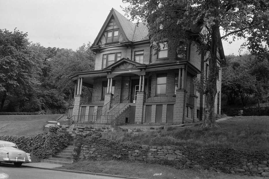 a black and white photo showing the exterior of william woogie harris house