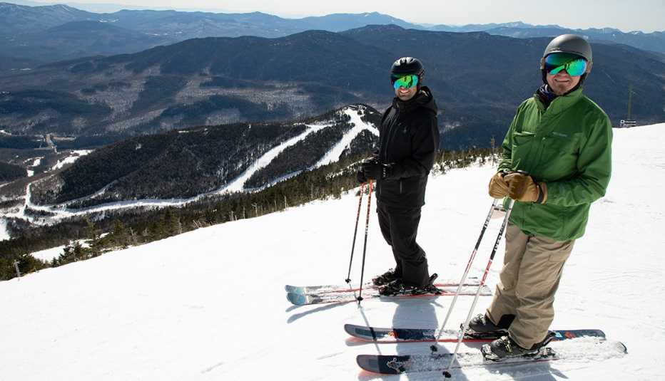 two people skiing on whiteface mountain on a bright day