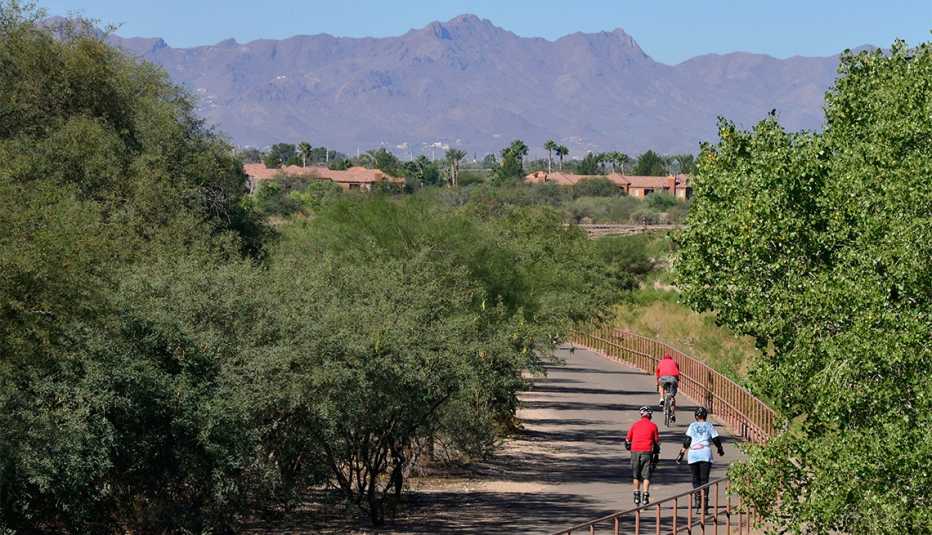Outdoor enthusiasts traverse The Loop at the Rillito River Park west of Craycroft Road in Tucson, Arizona