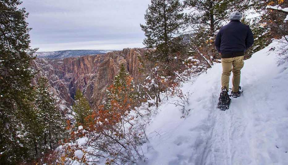 Seth Boster snowshoes the 2-mile Oak Flat Loop Trail on the south rim of Black Canyon 