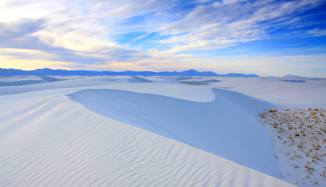 white sand dunes under a blue sky in white sands national park new mexico