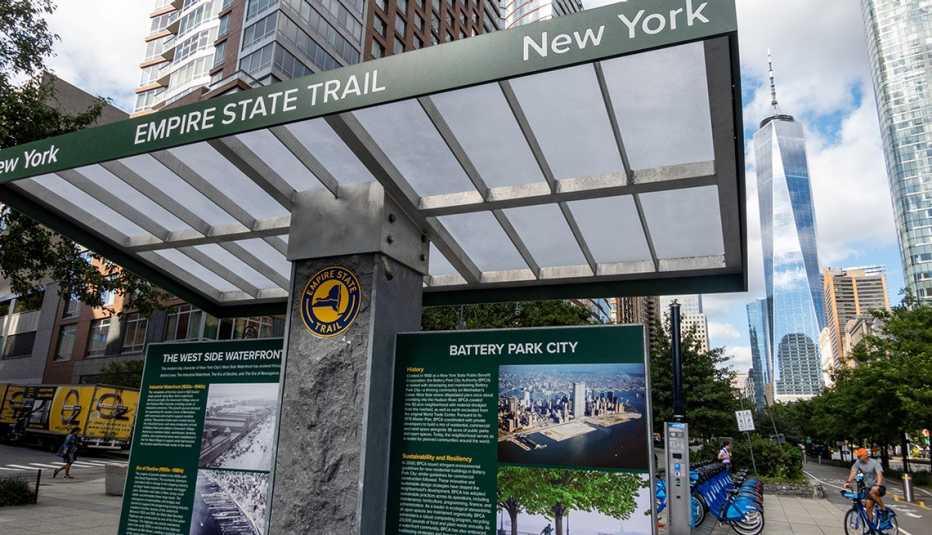an Empire State Trail kiosk and signage in lower Manhattan