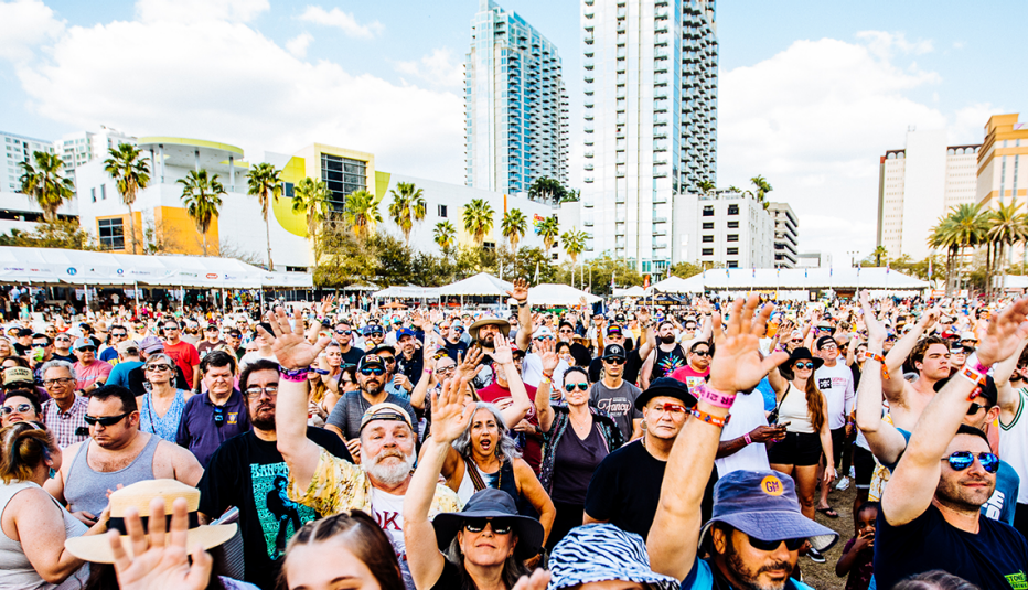 a crowd cheering for hip hop group arrested development at the gasparilla music festival in tampa bay florida