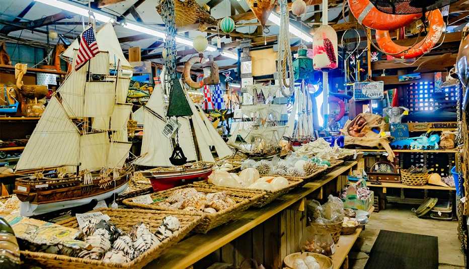 Seashells, model ships, nautical souvenirs, and memorabilia are crowded onto shelves in Apalachicola, Florida