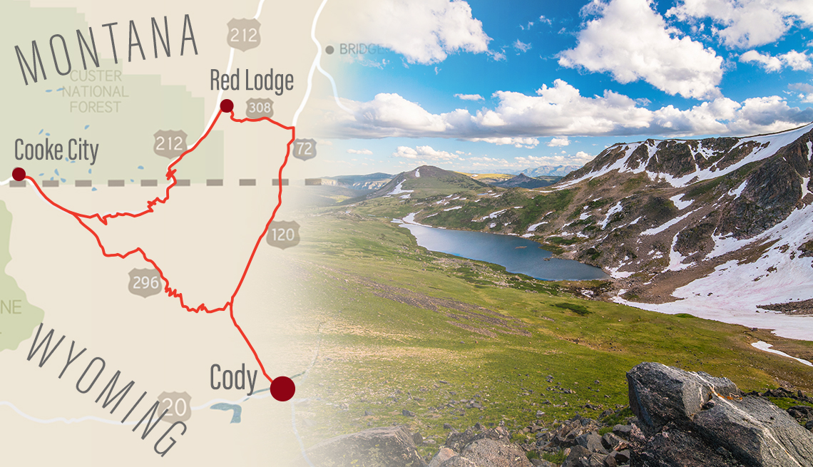 a road map with a driving route marked on it from cody wyoming to points in montana superimposed over a photo taken from the scenic beartooth highway