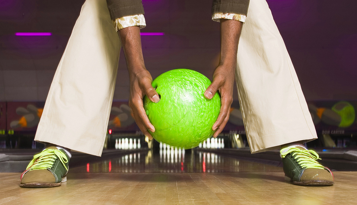 Man Holds Green Bowling Ball, Backwards on Bowling Lane, Lowballed Your Target Salary? Yes, You Can Ask For More
