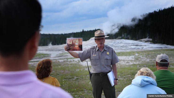 Great part-time jobs for seniors at national parks- a ranger explains facts about the Old Faithful geyser in Yellowstone National Park
