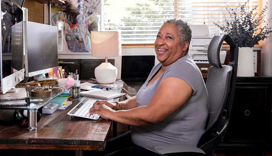 Paulette Weems working at a desk from home.
